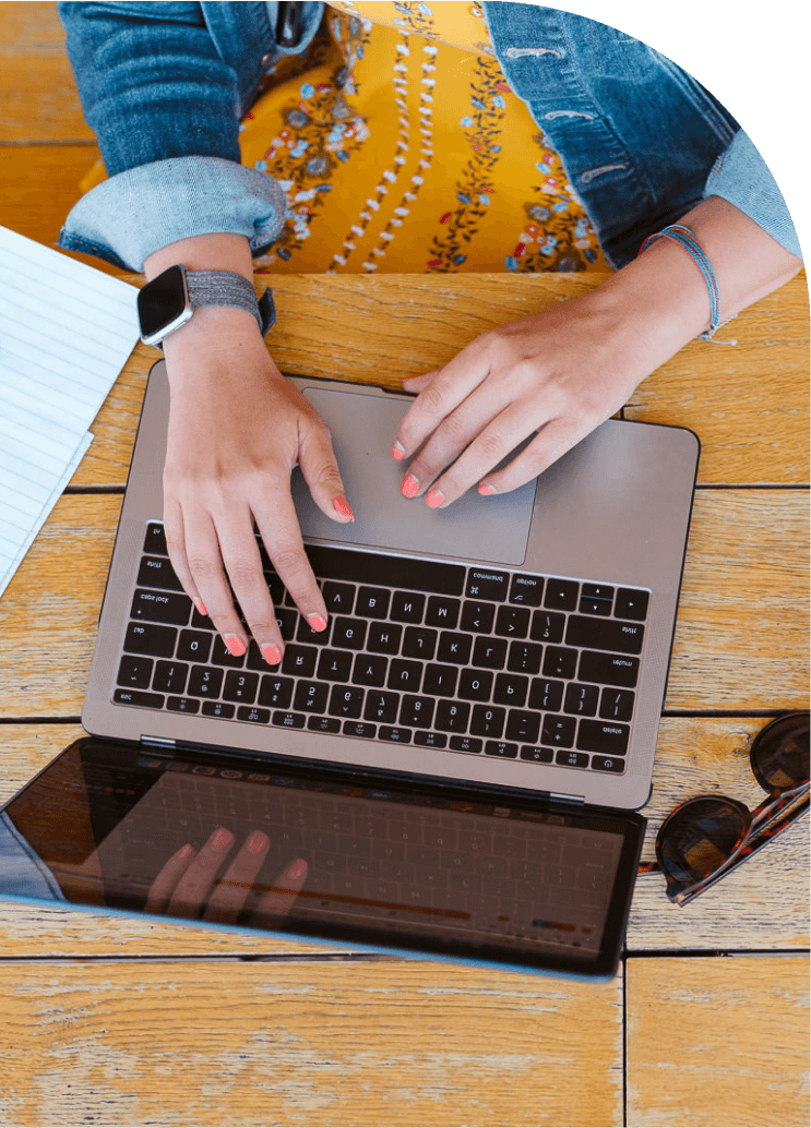 Photo of hands using a laptop