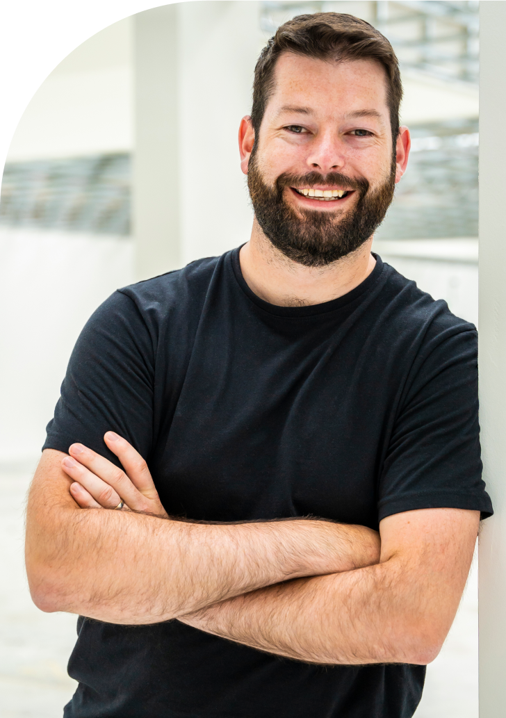 Man smiling next to WordPress monitoring platform